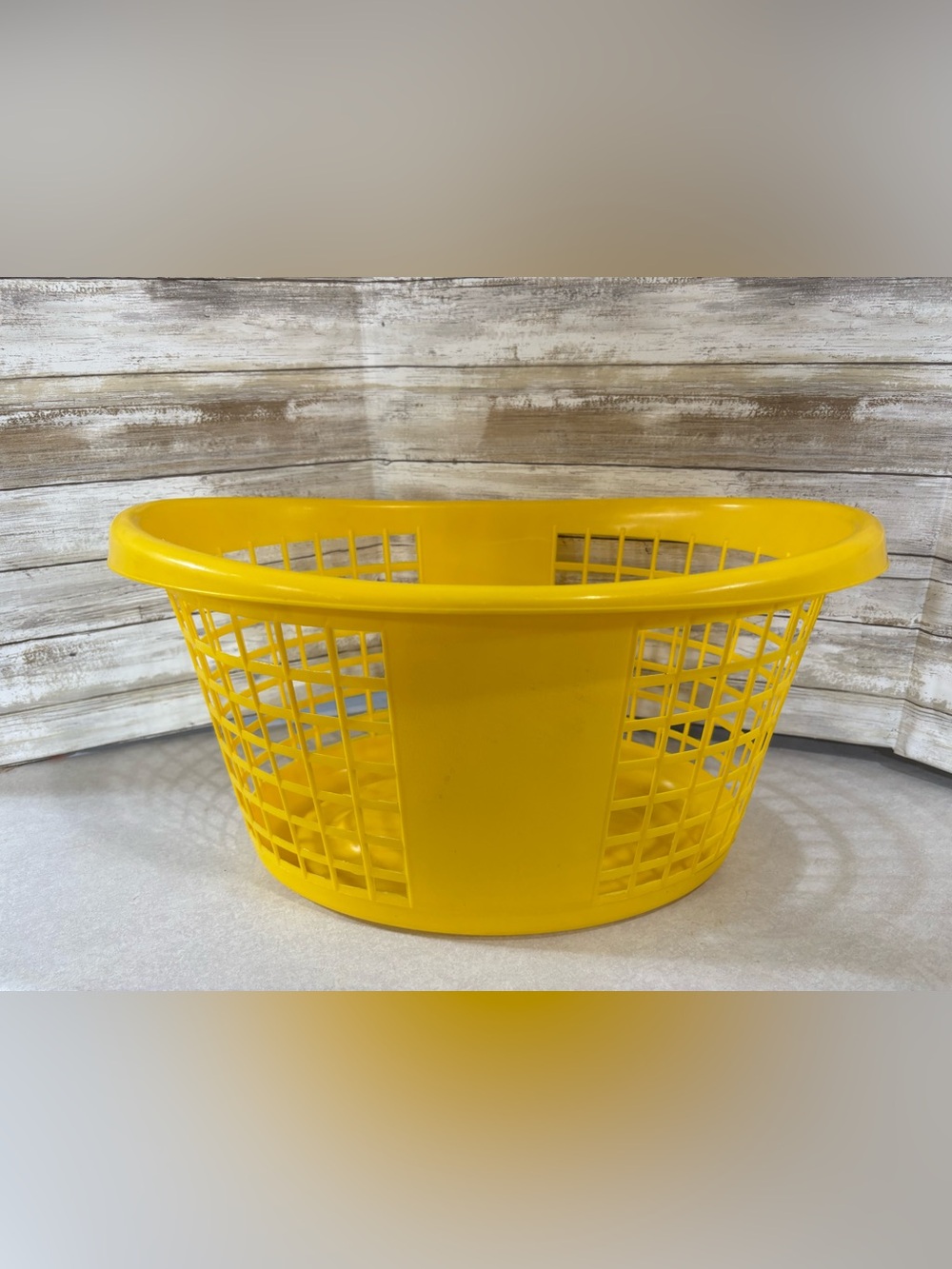 Bright yellow vintage laundry basket